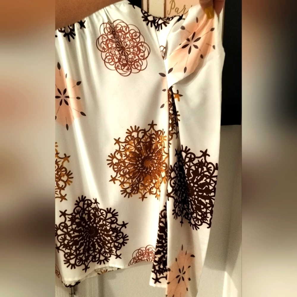 white long sleeve shirt with brown and pink designs